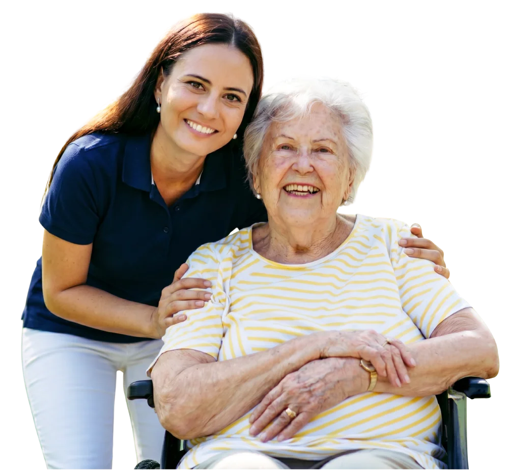 Caregiver supporting an elderly woman in a wheelchair.